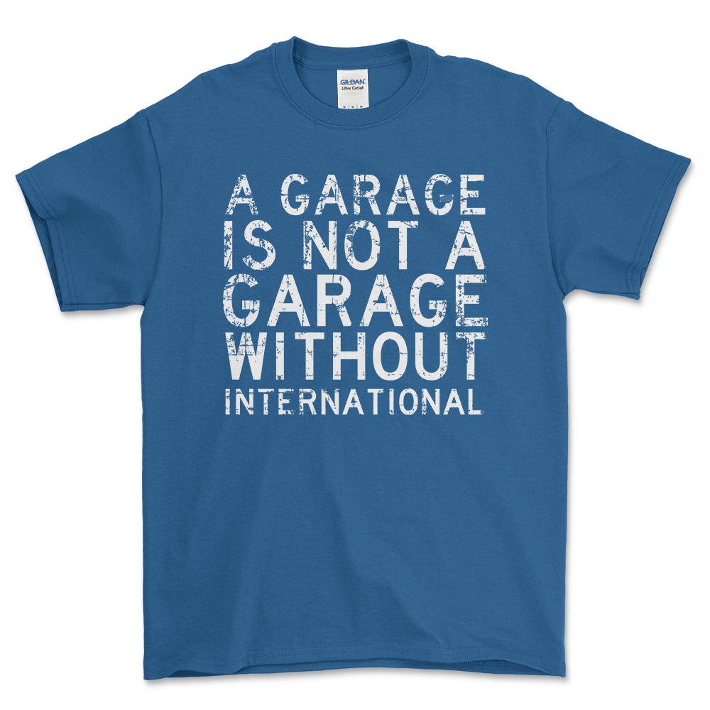 International - A Garage Is Not A Garage Without International - Unisex T-Shirt , Bomuld-Beklædning-International-Blå Royal-S-Forside-Garage Culture Shop- garage - man cave - merchandise