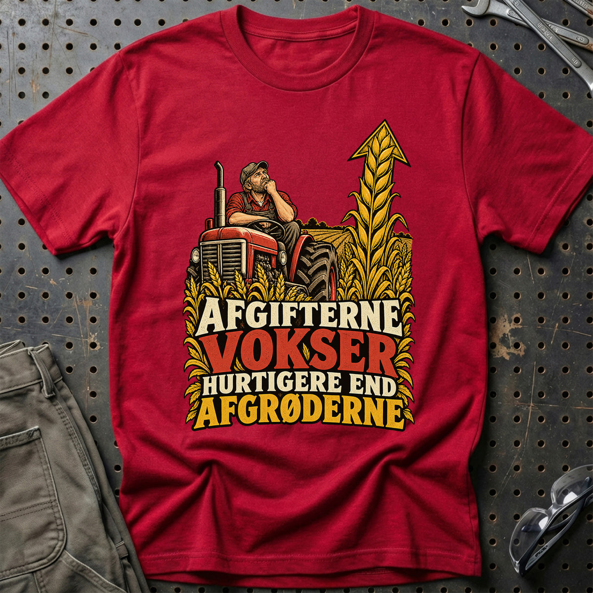 
Afgifterne vokser hurtigere end afgrøderne – Illustration – Unisex T-Shirt – Rød